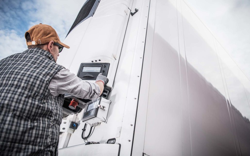 Truck driver adjusting temp on trailer as a freight broker solution