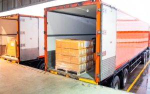 Image of a trailer truck loaded with crates of packages.