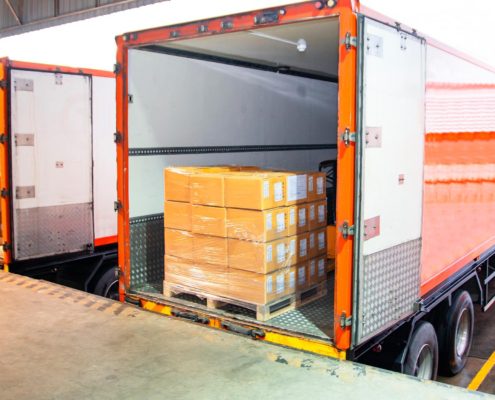 Image of a trailer truck loaded with crates of packages.